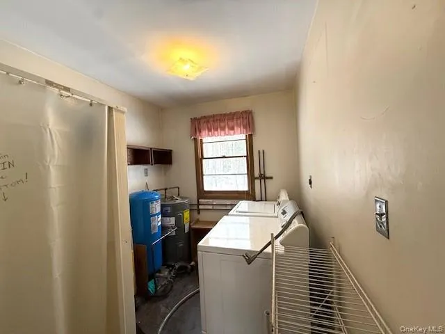 a room that has a bed and a window in it