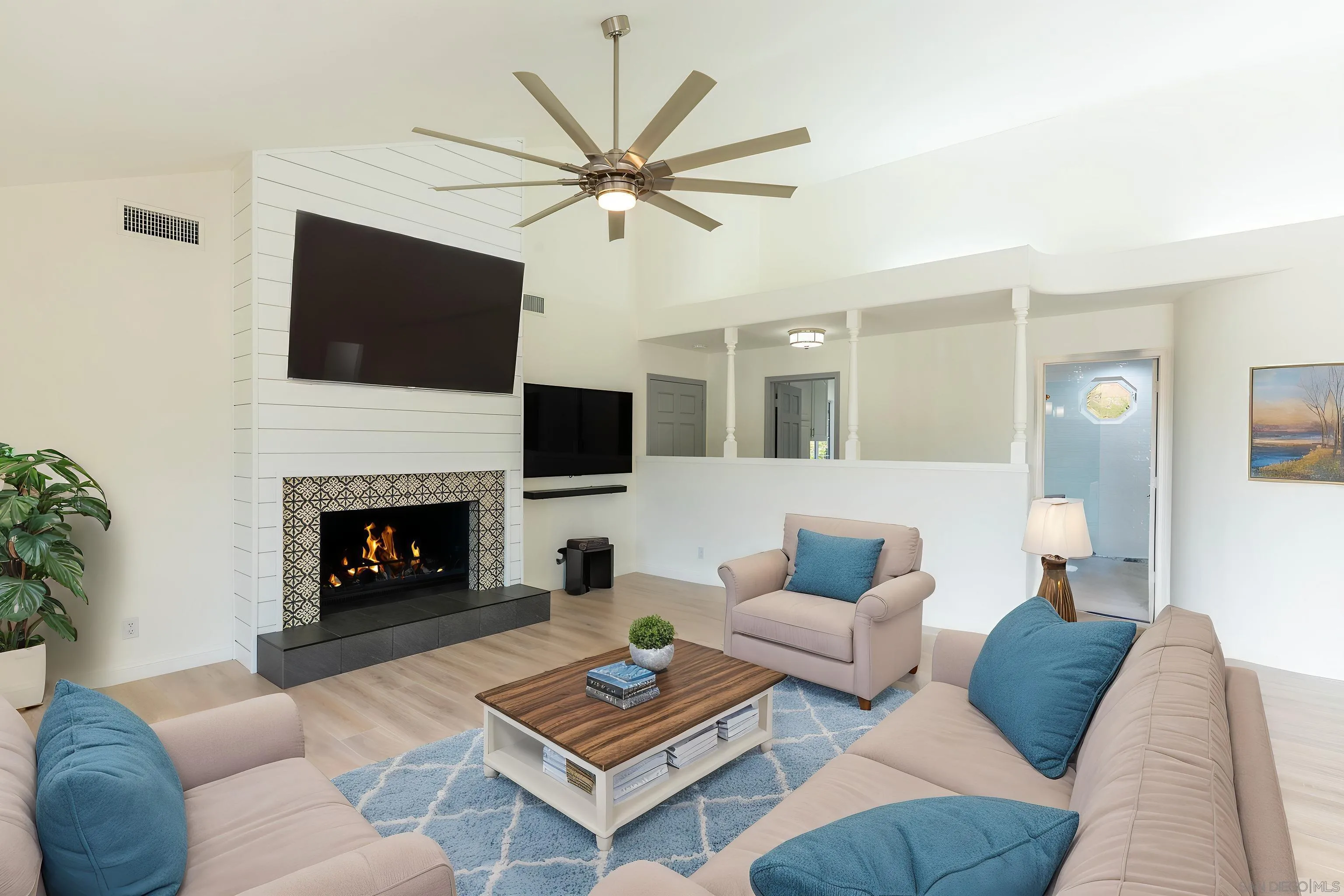 3649 Laketree Drive Fallbrook, CA 92028 - Photo 13 of 42 a living room with furniture a flat screen tv and a fireplace
