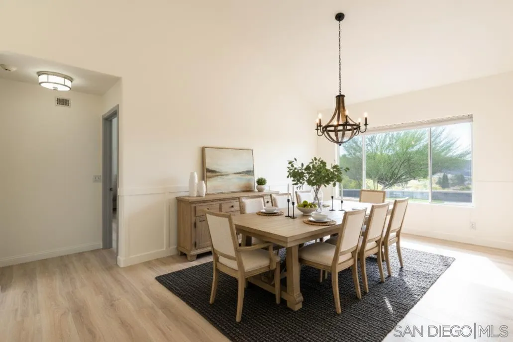 3649 Laketree Drive Fallbrook, CA 92028 - Photo 15 of 42 a view of a dining room with furniture window and wooden floor