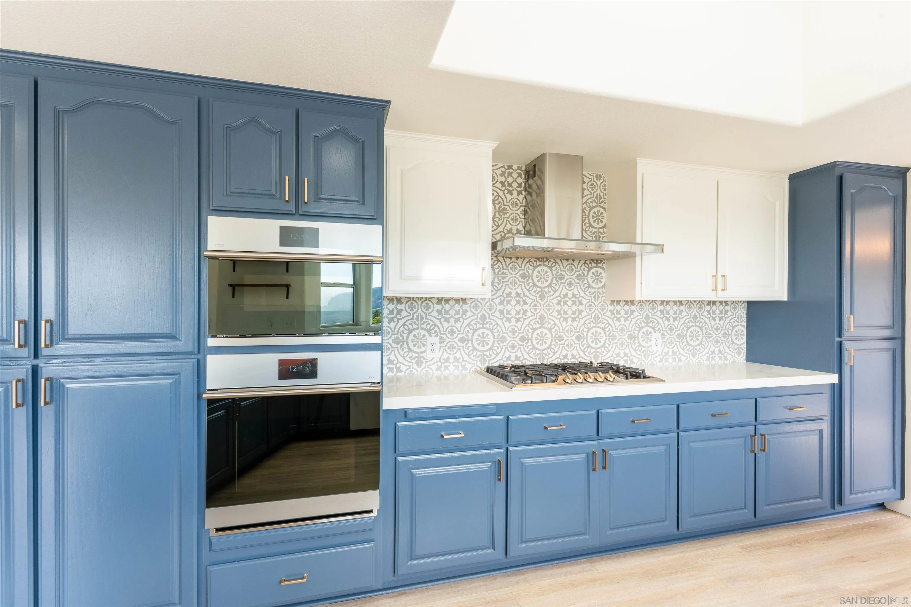 3649 Laketree Drive Fallbrook, CA 92028 - Photo 20 of 42 a kitchen with stainless steel appliances granite countertop a stove a microwave and a refrigerator