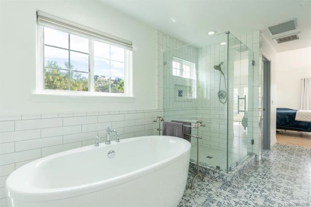 a bathroom with a sink vanity and a mirror