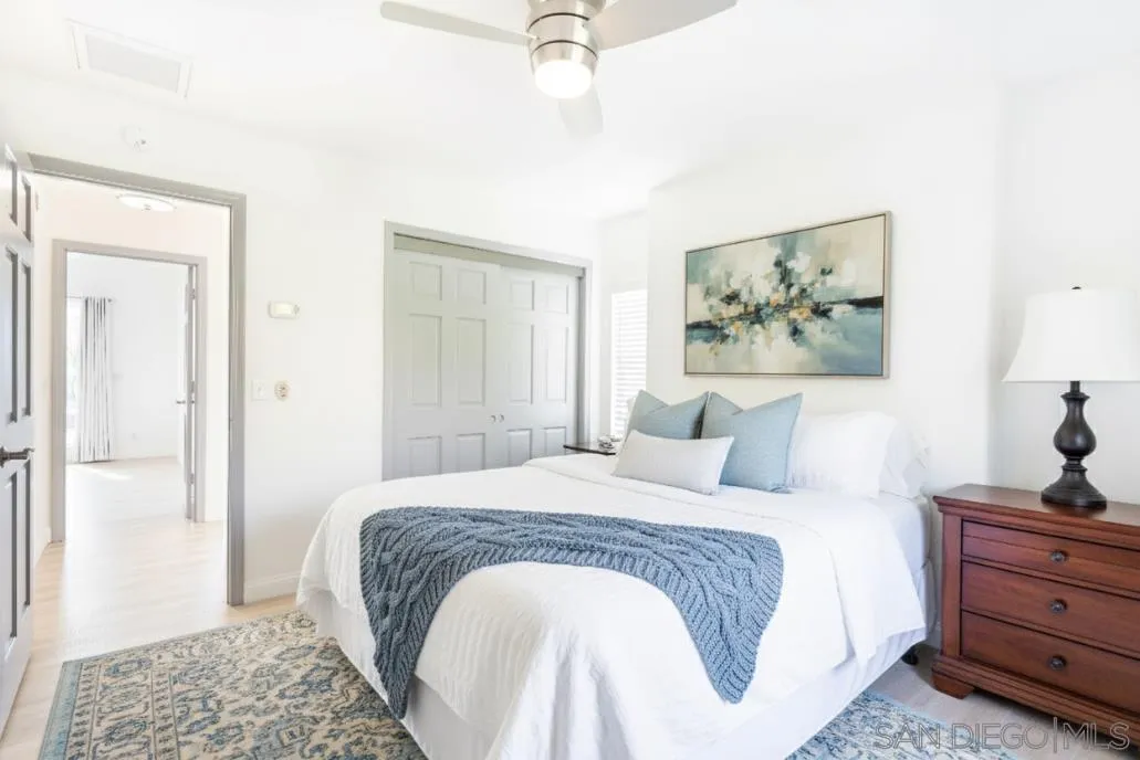 3649 Laketree Drive Fallbrook, CA 92028 - Photo 30 of 42 a bedroom with a bed and a painting on the wall