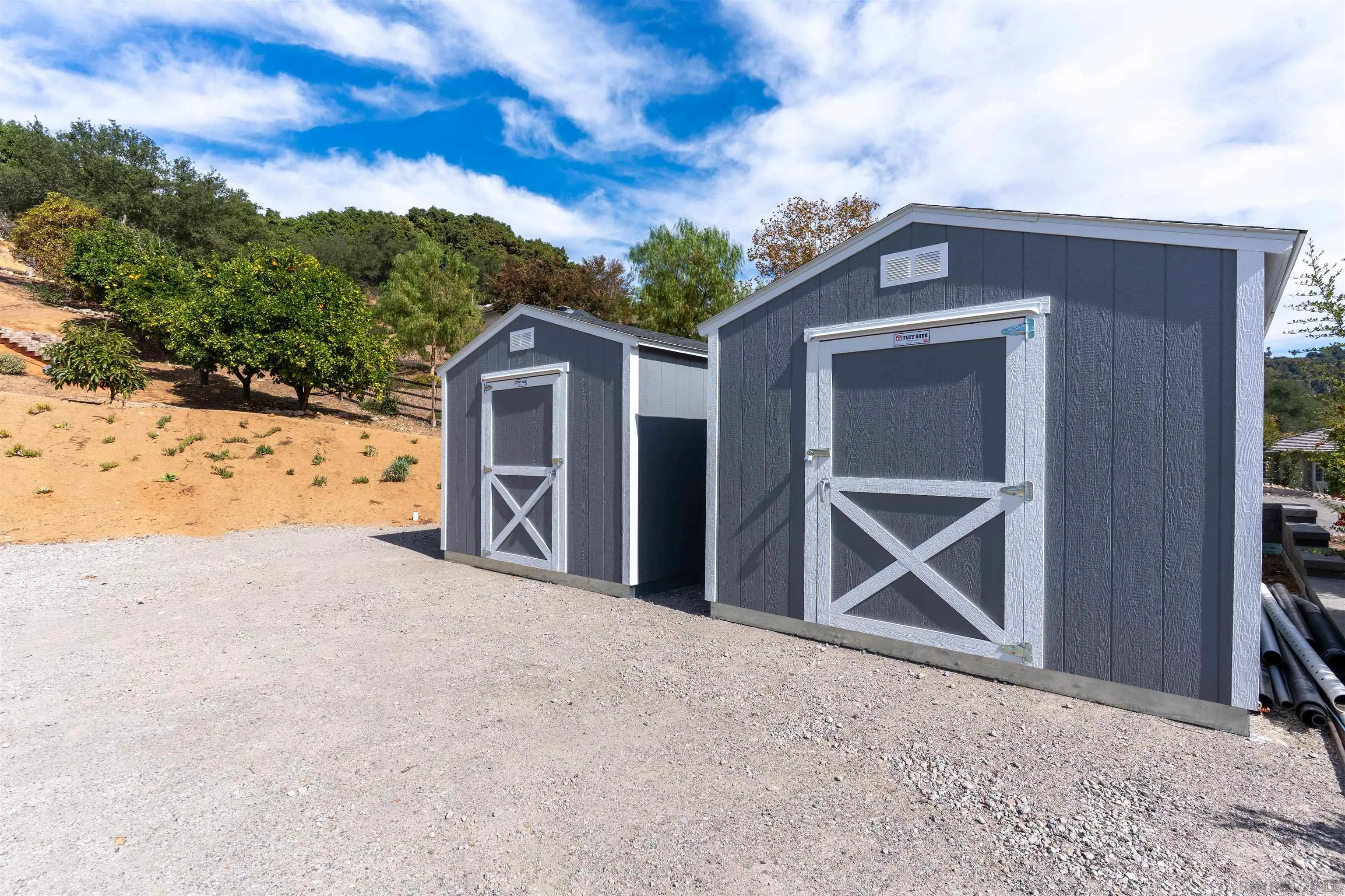 3649 Laketree Drive Fallbrook, CA 92028 - Photo 37 of 42 a view of an house with backyard and garden