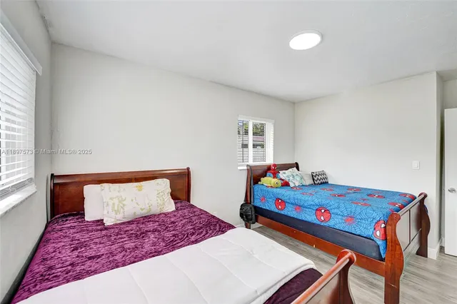 a bedroom with a bed and cabinets