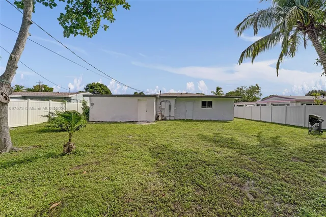 an aerial view of a house with a garden