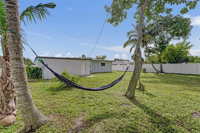 an aerial view of a house with a garden