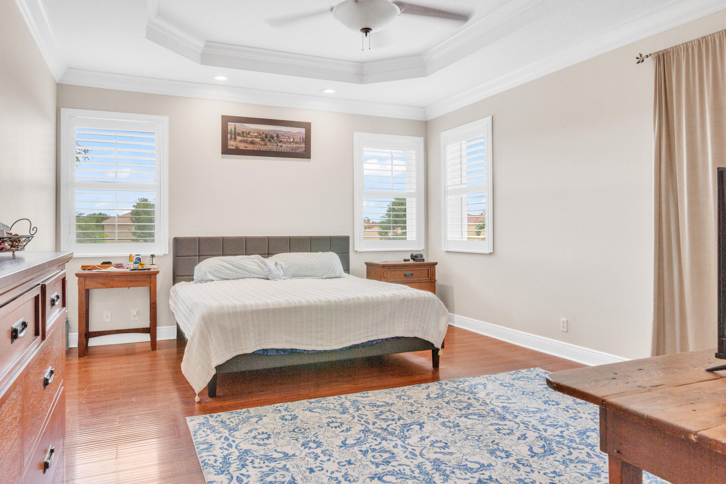 8155 Viale Matera Lake Worth, FL 33467 - Photo 11 of 14 a bedroom with a bed and a window