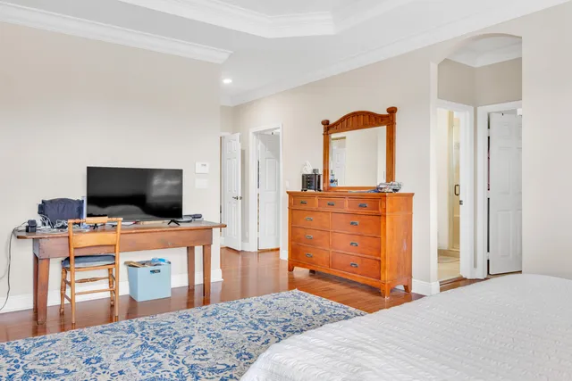 a bedroom with a bed and television