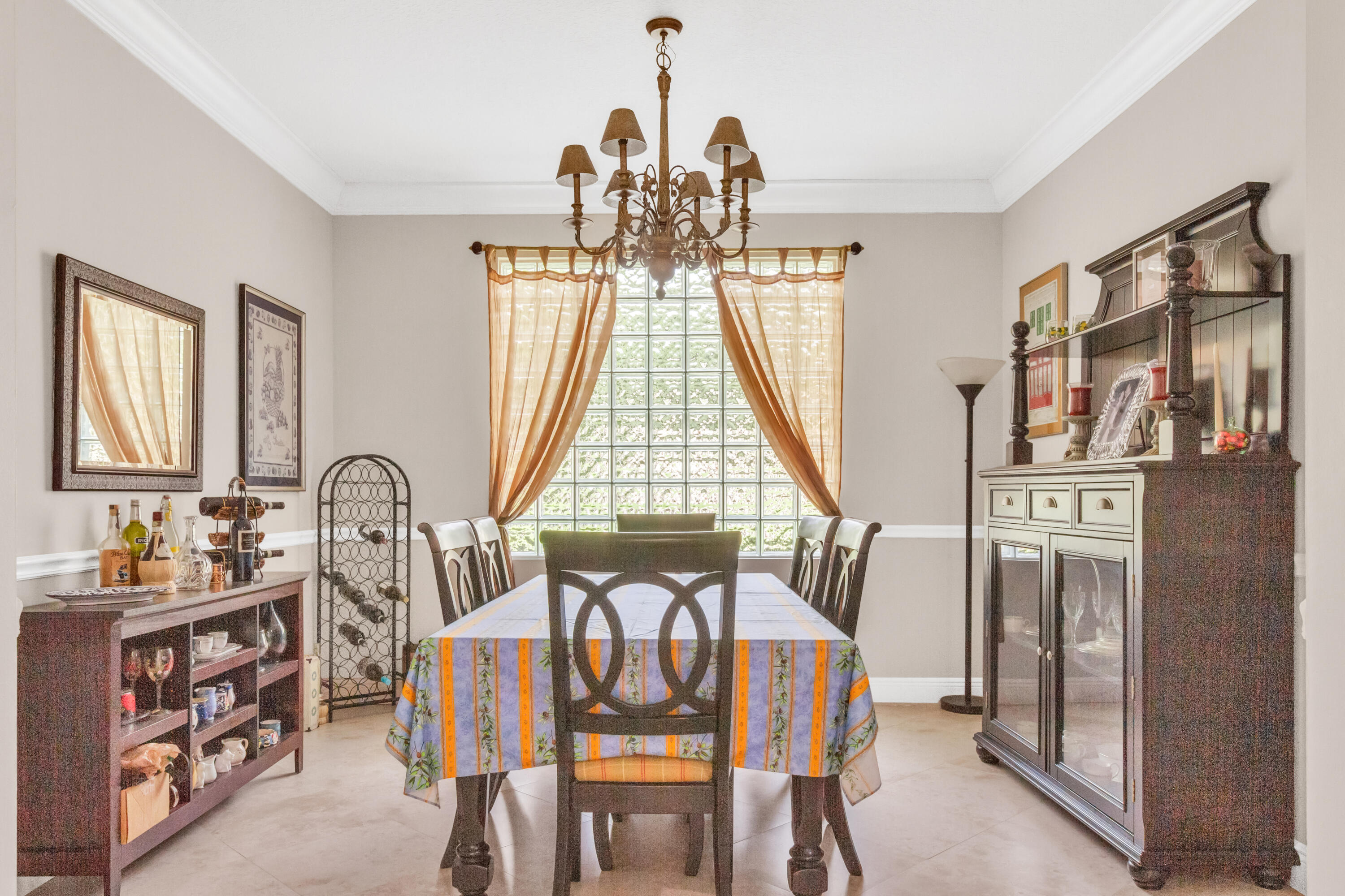 8155 Viale Matera Lake Worth, FL 33467 - Photo 2 of 14 a view of a dining room with furniture and a chandelier