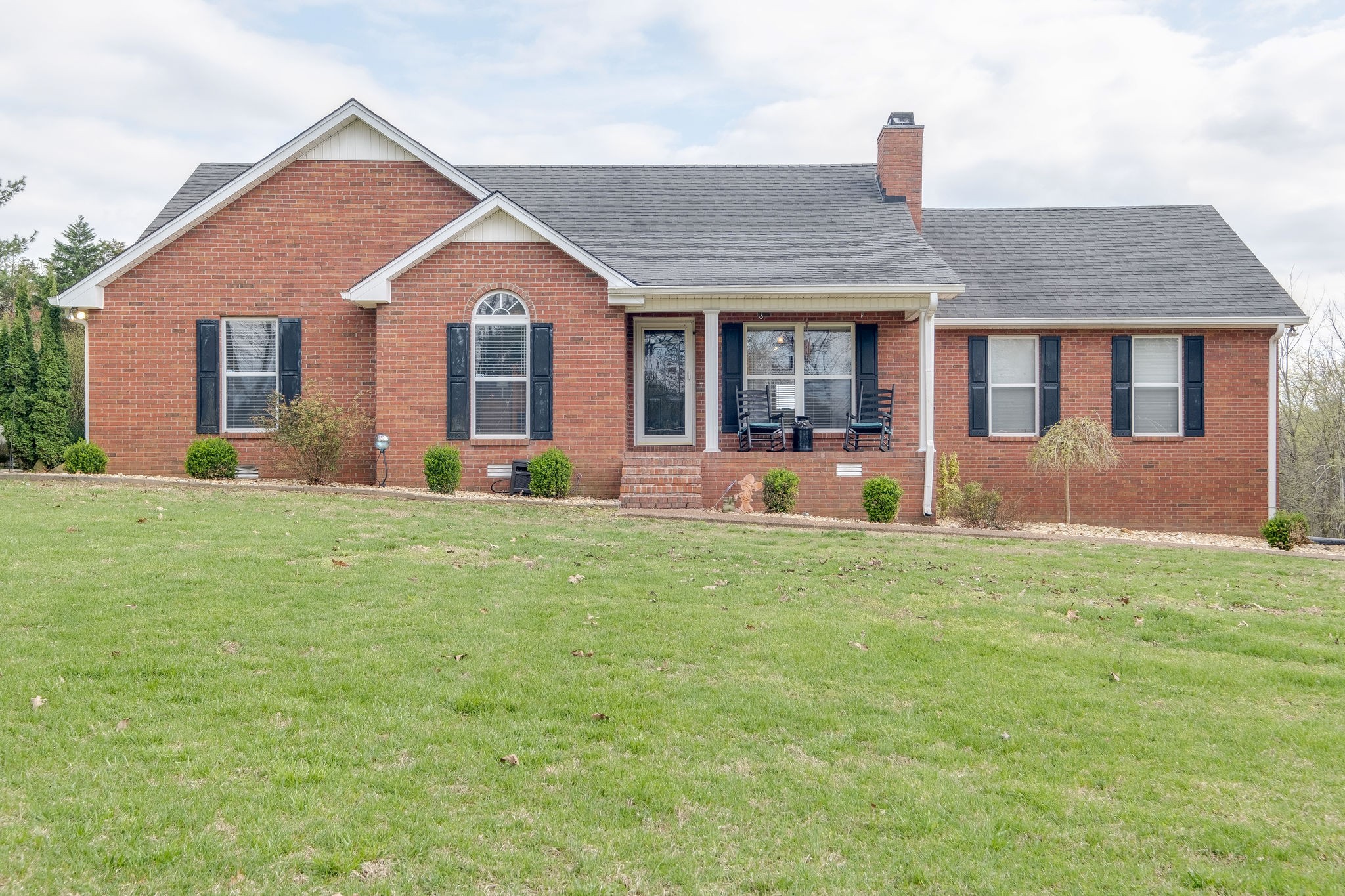 320 Crafton Road Portland, TN 37148 - Photo 1 of 28 a front view of a house with a yard and porch