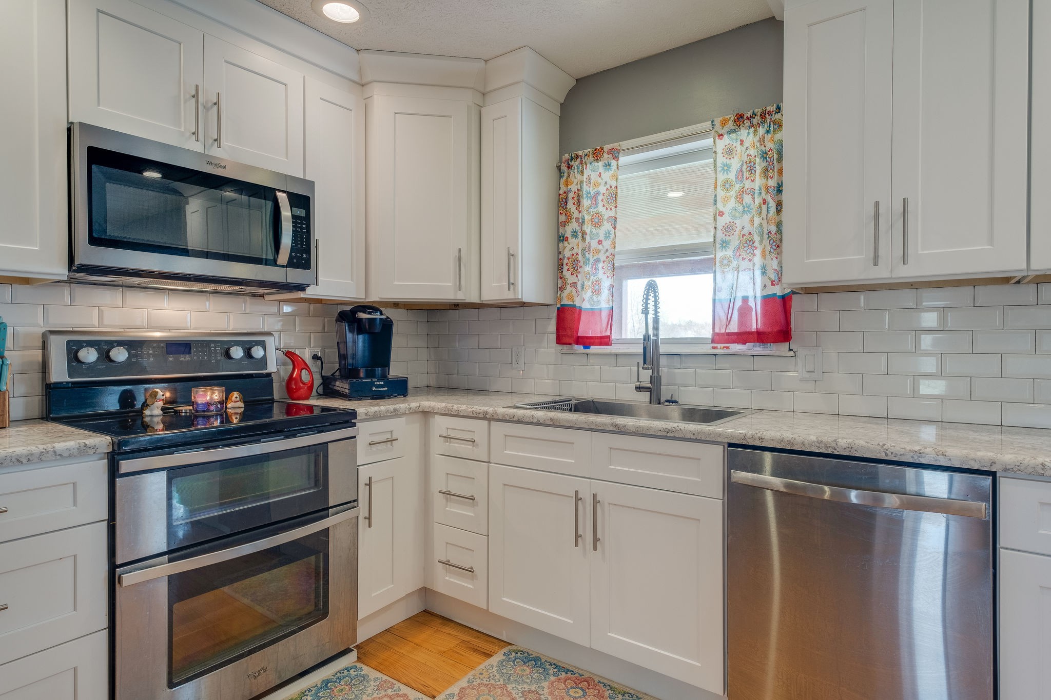 320 Crafton Road Portland, TN 37148 - Photo 13 of 28 a kitchen with stainless steel appliances granite countertop a sink stove and microwave