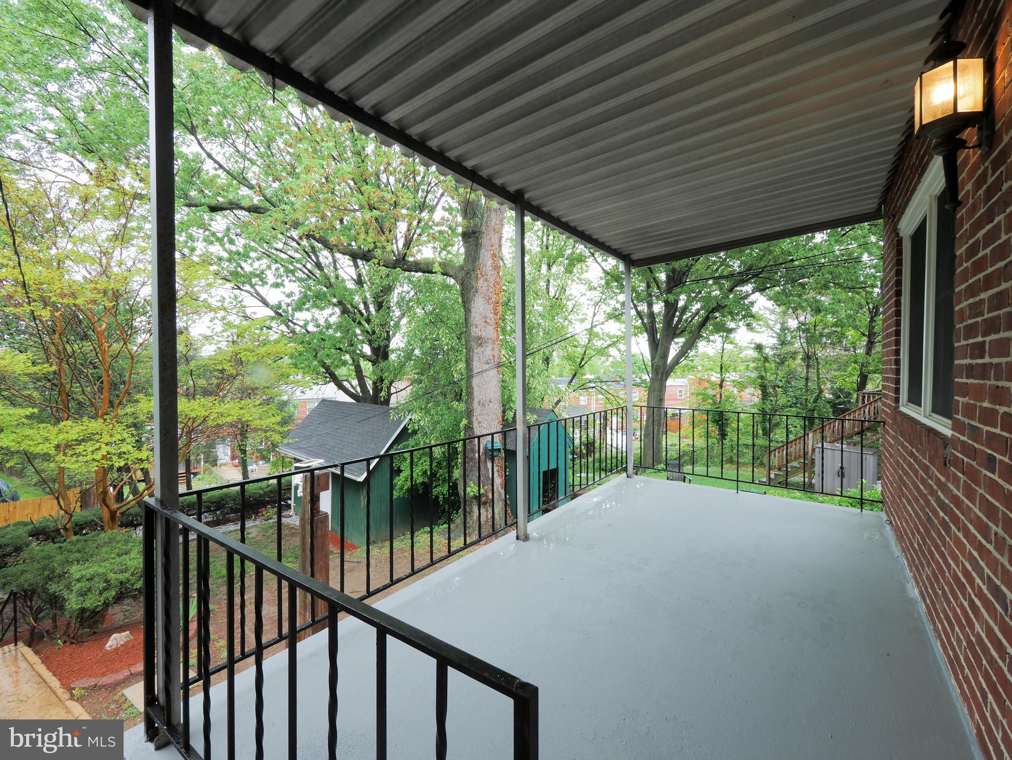5526 Channing Road Baltimore, MD 21229 - Photo 19 of 42 Backyard with covered porch