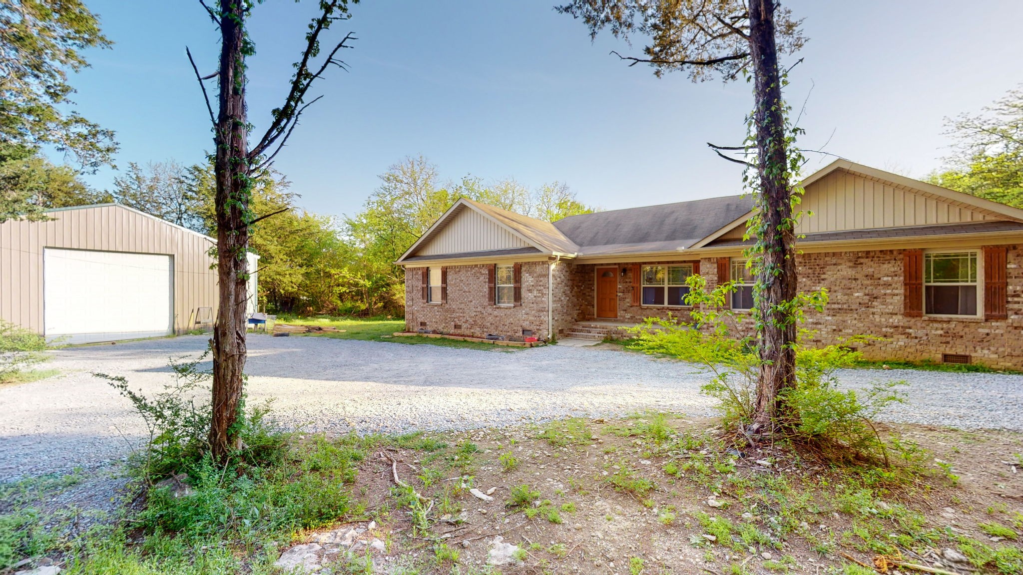 22 Warden Road Fayetteville, TN 37334 - Photo 1 of 34 a front view of a house with a yard and garage