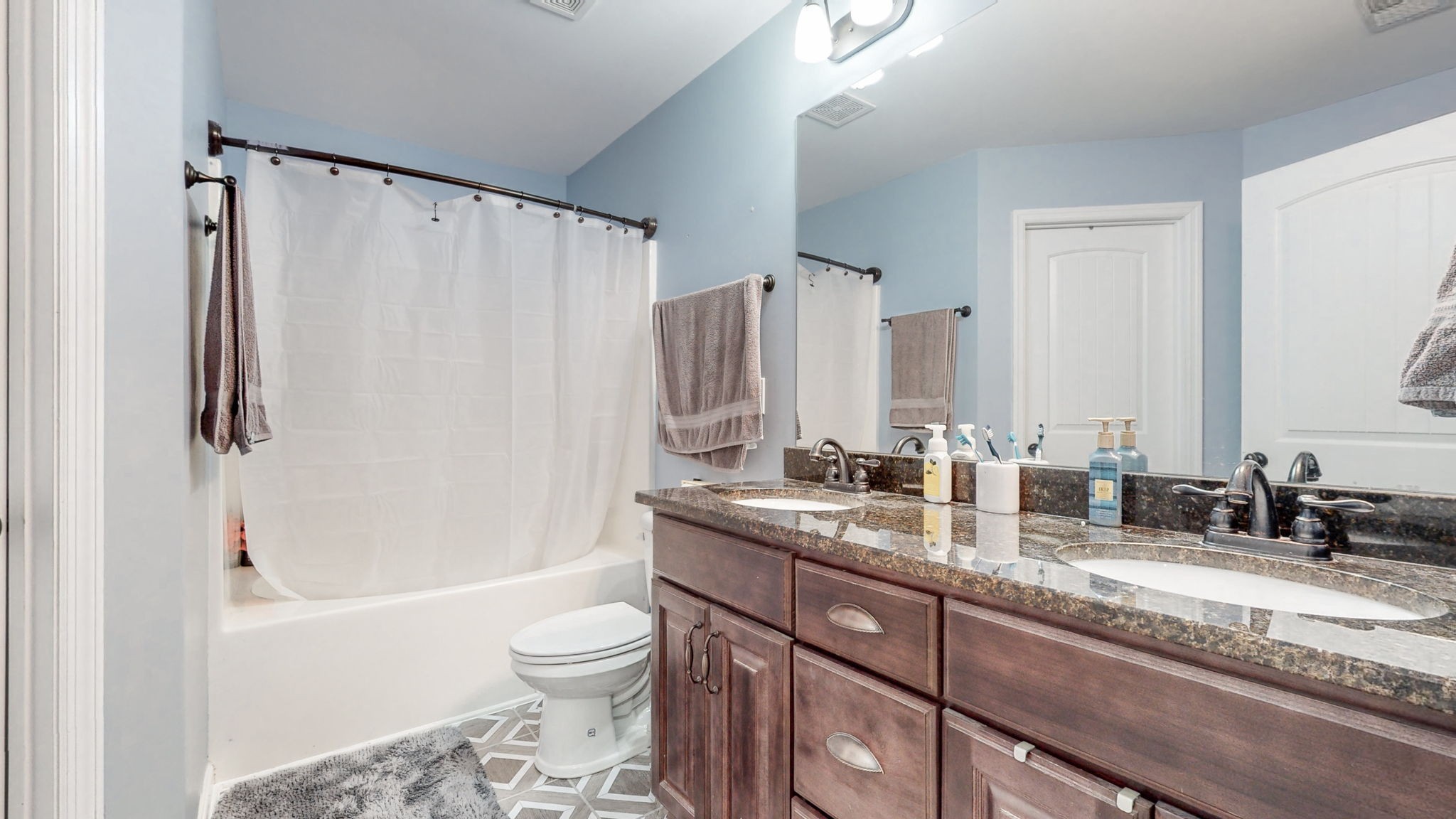 22 Warden Road Fayetteville, TN 37334 - Photo 13 of 34 a bathroom with a granite countertop sink toilet and shower