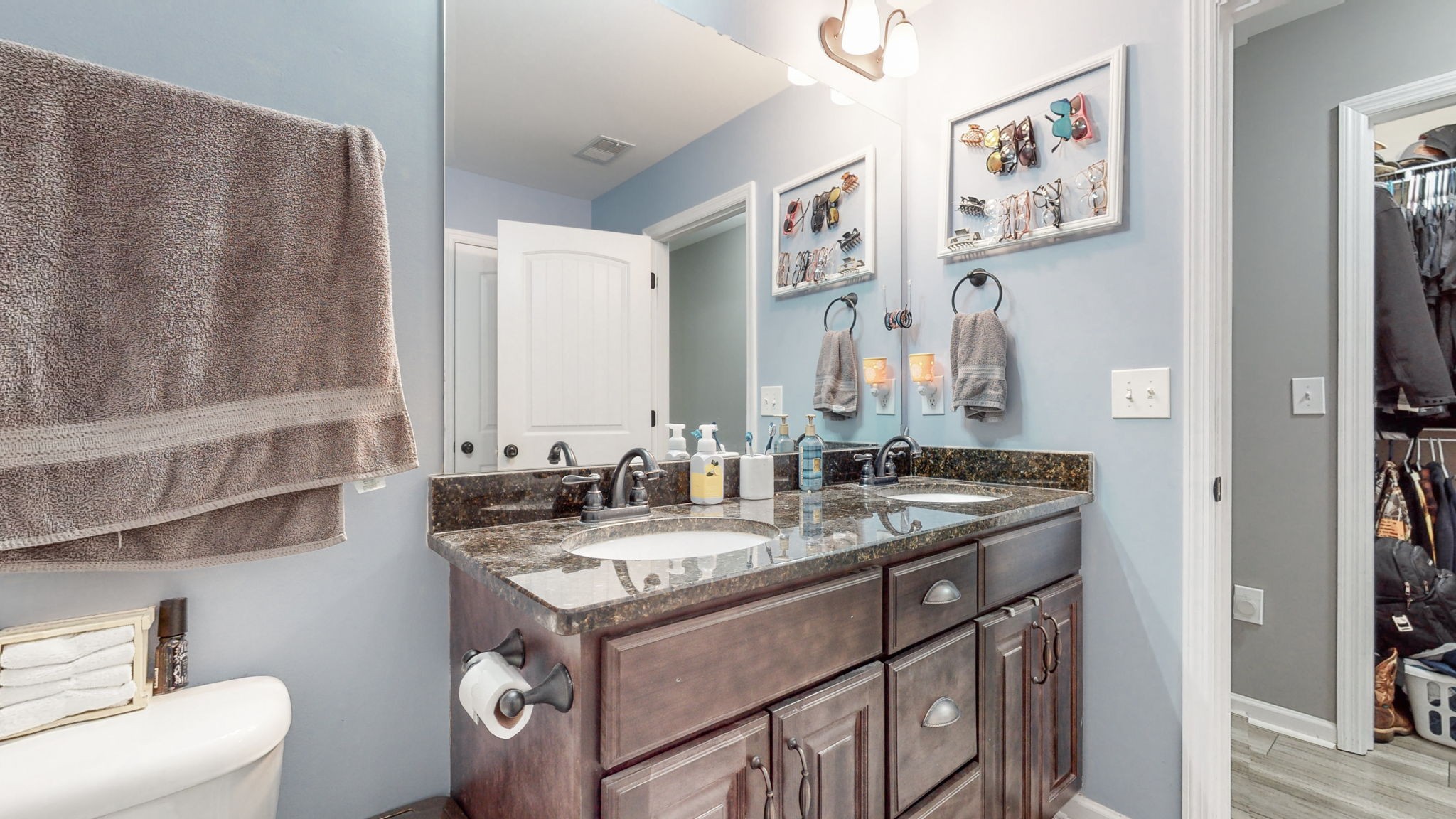 22 Warden Road Fayetteville, TN 37334 - Photo 14 of 34 a bathroom with a granite countertop sink a mirror and a toilet