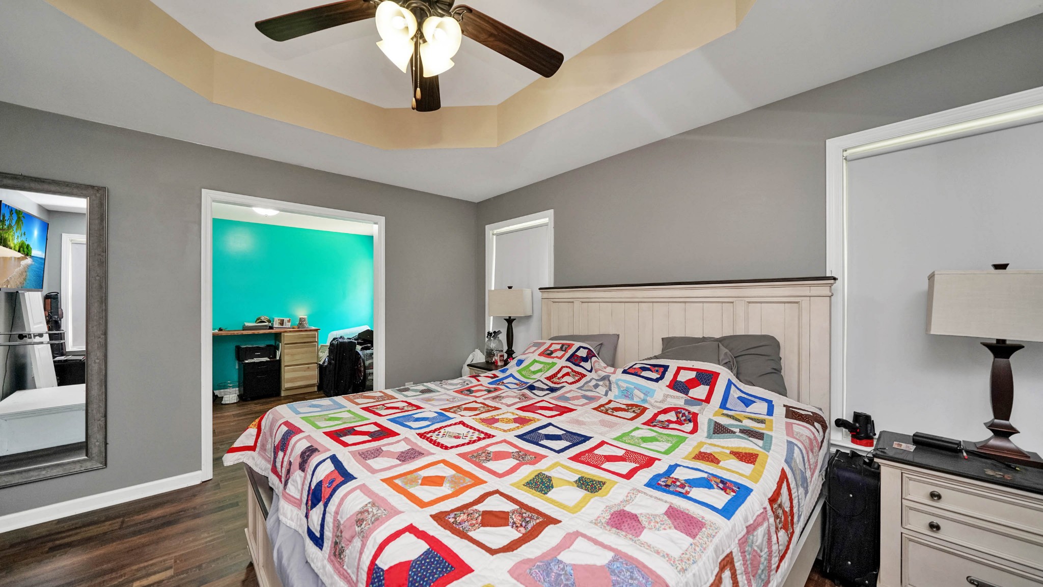 22 Warden Road Fayetteville, TN 37334 - Photo 16 of 34 a bedroom with a bed and a chandelier