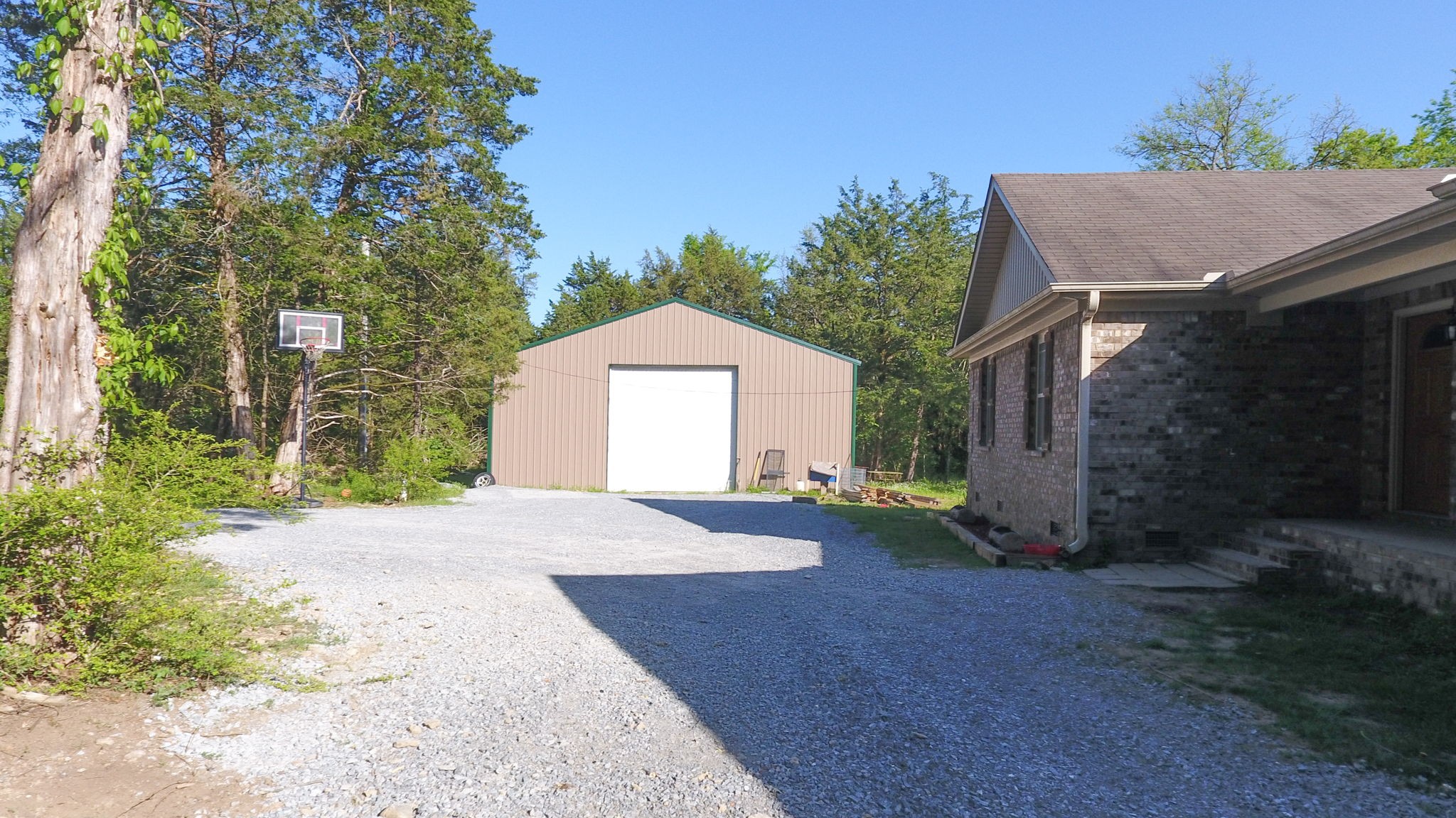 22 Warden Road Fayetteville, TN 37334 - Photo 24 of 34 a front view of a house with a yard and garage