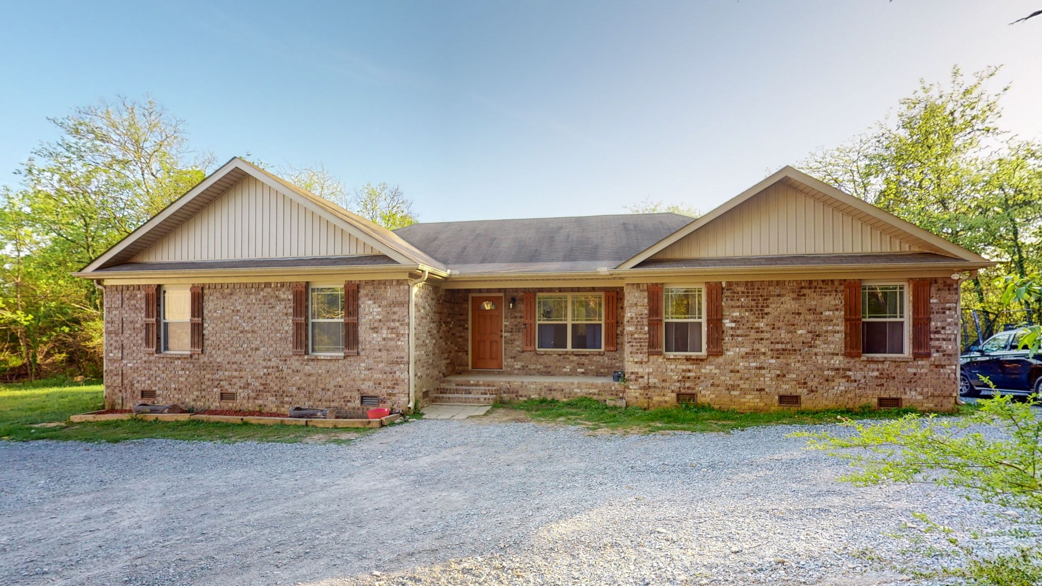 22 Warden Road Fayetteville, TN 37334 - Photo 3 of 34 a front view of a house with garden