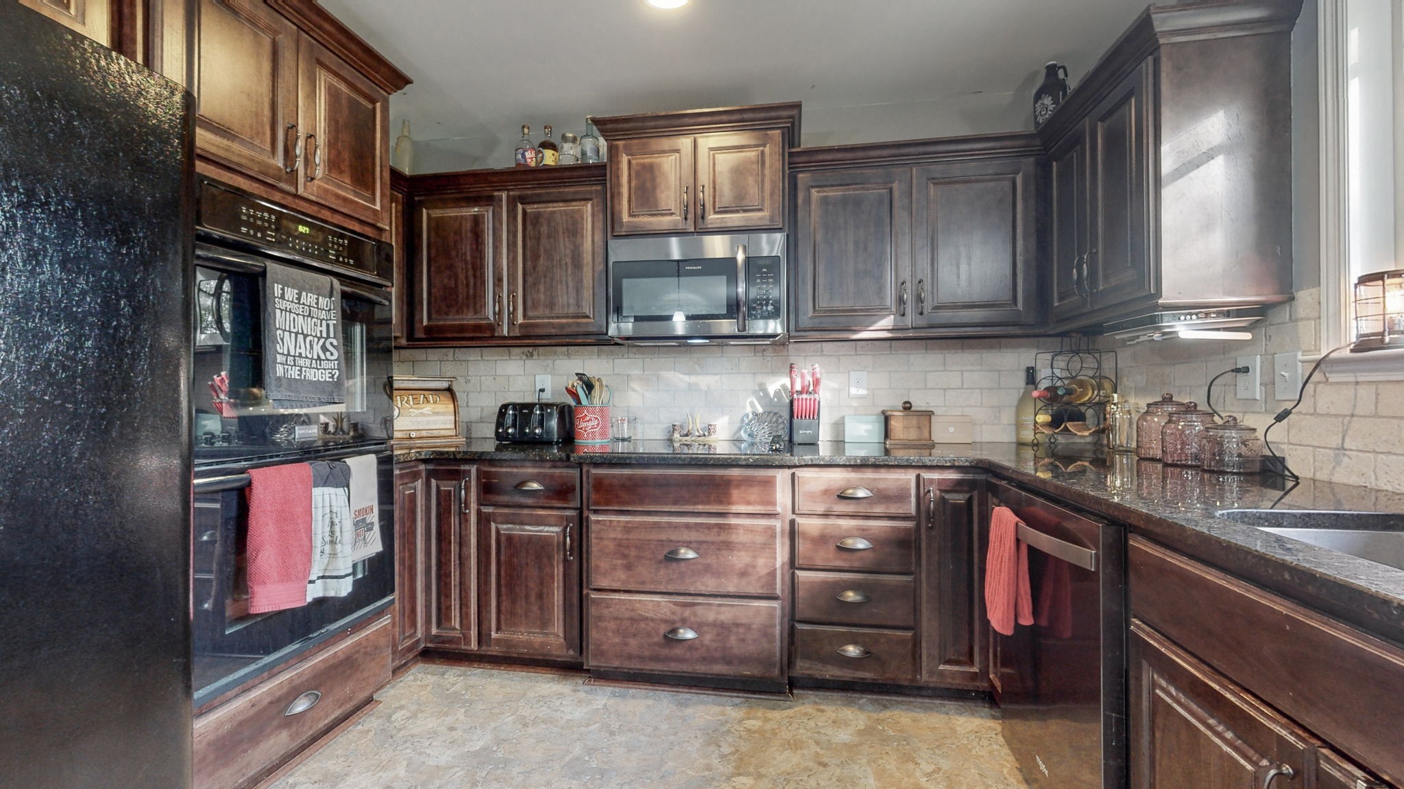 22 Warden Road Fayetteville, TN 37334 - Photo 7 of 34 a kitchen with stainless steel appliances granite countertop a sink and cabinets