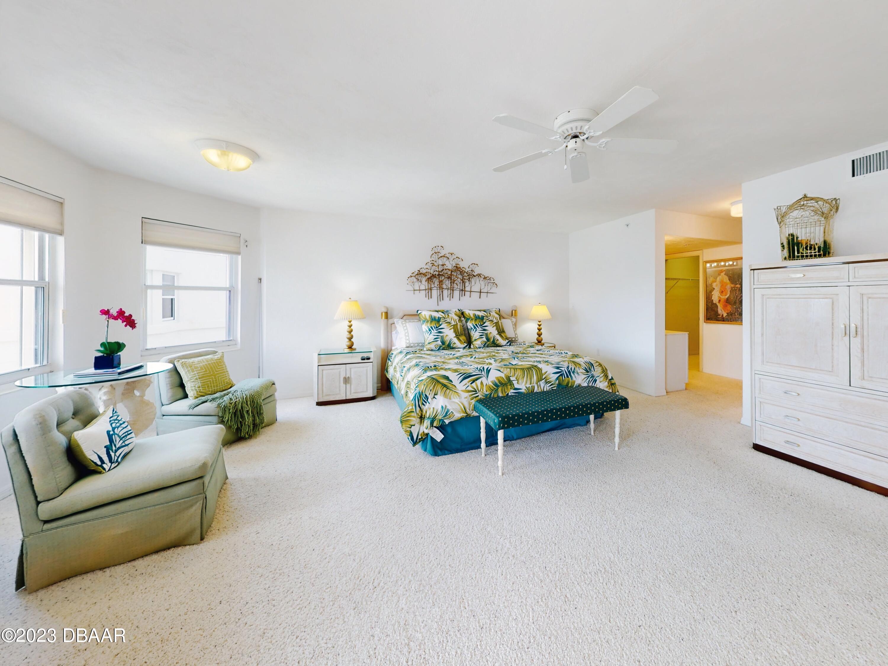 1 John Anderson Drive, Unit PH7 Ormond Beach, FL 32176 - Photo 15 of 134 a living room with furniture and a chandelier