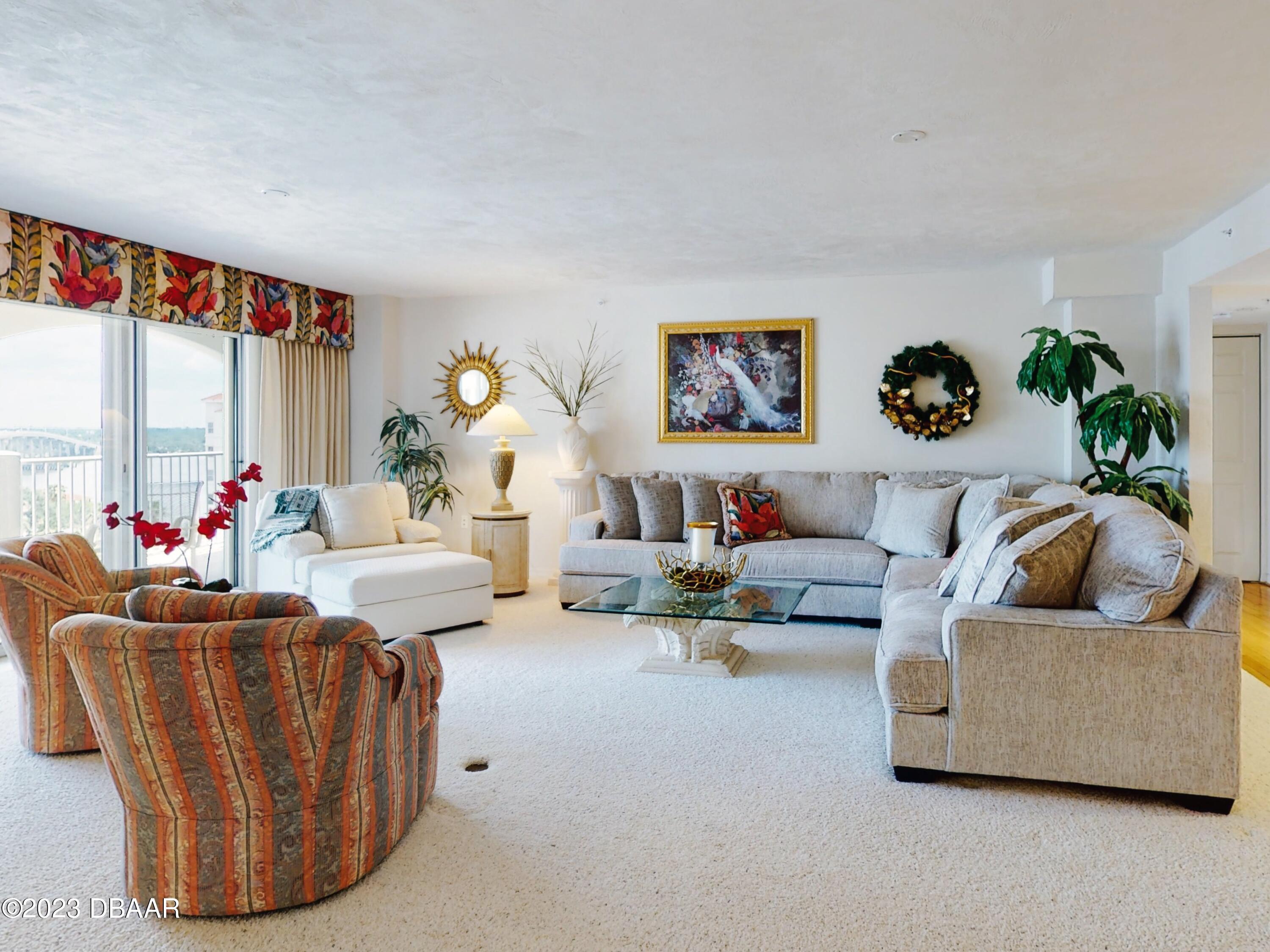 1 John Anderson Drive, Unit PH7 Ormond Beach, FL 32176 - Photo 34 of 134 a living room with furniture and a large window