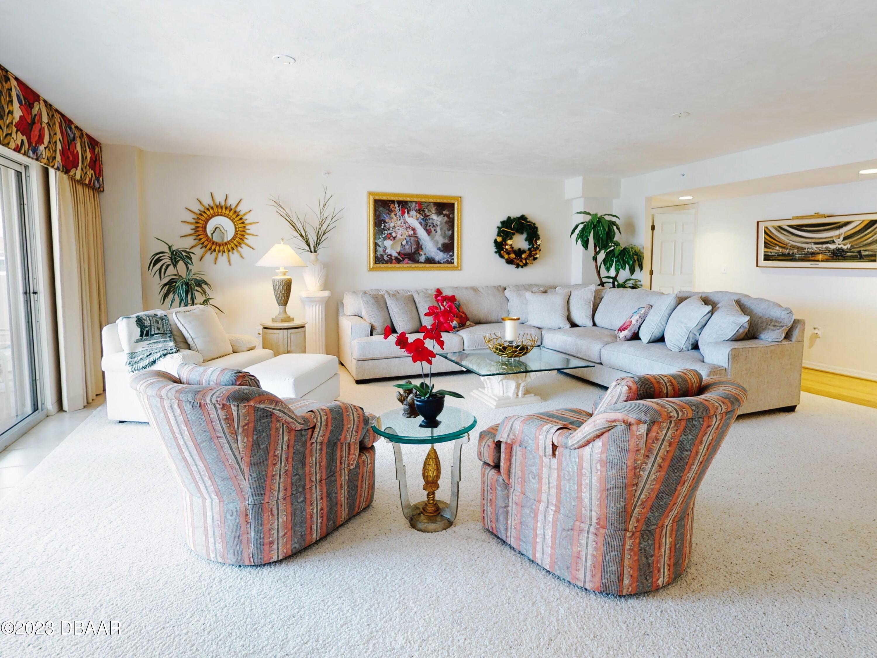 1 John Anderson Drive, Unit PH7 Ormond Beach, FL 32176 - Photo 42 of 134 a living room with furniture and wall paintings
