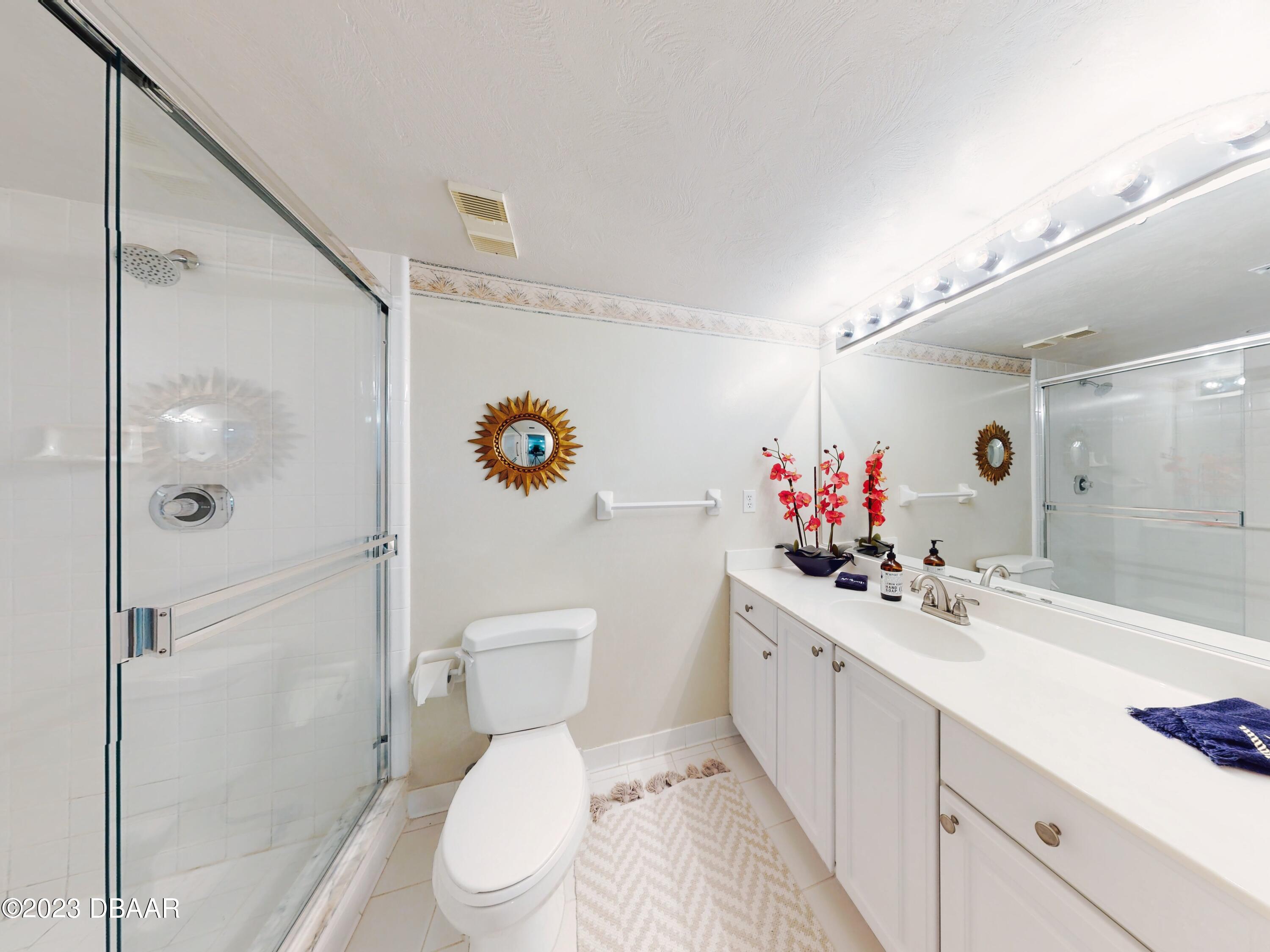 1 John Anderson Drive, Unit PH7 Ormond Beach, FL 32176 - Photo 79 of 134 a bathroom with a sink mirror toilet and shower