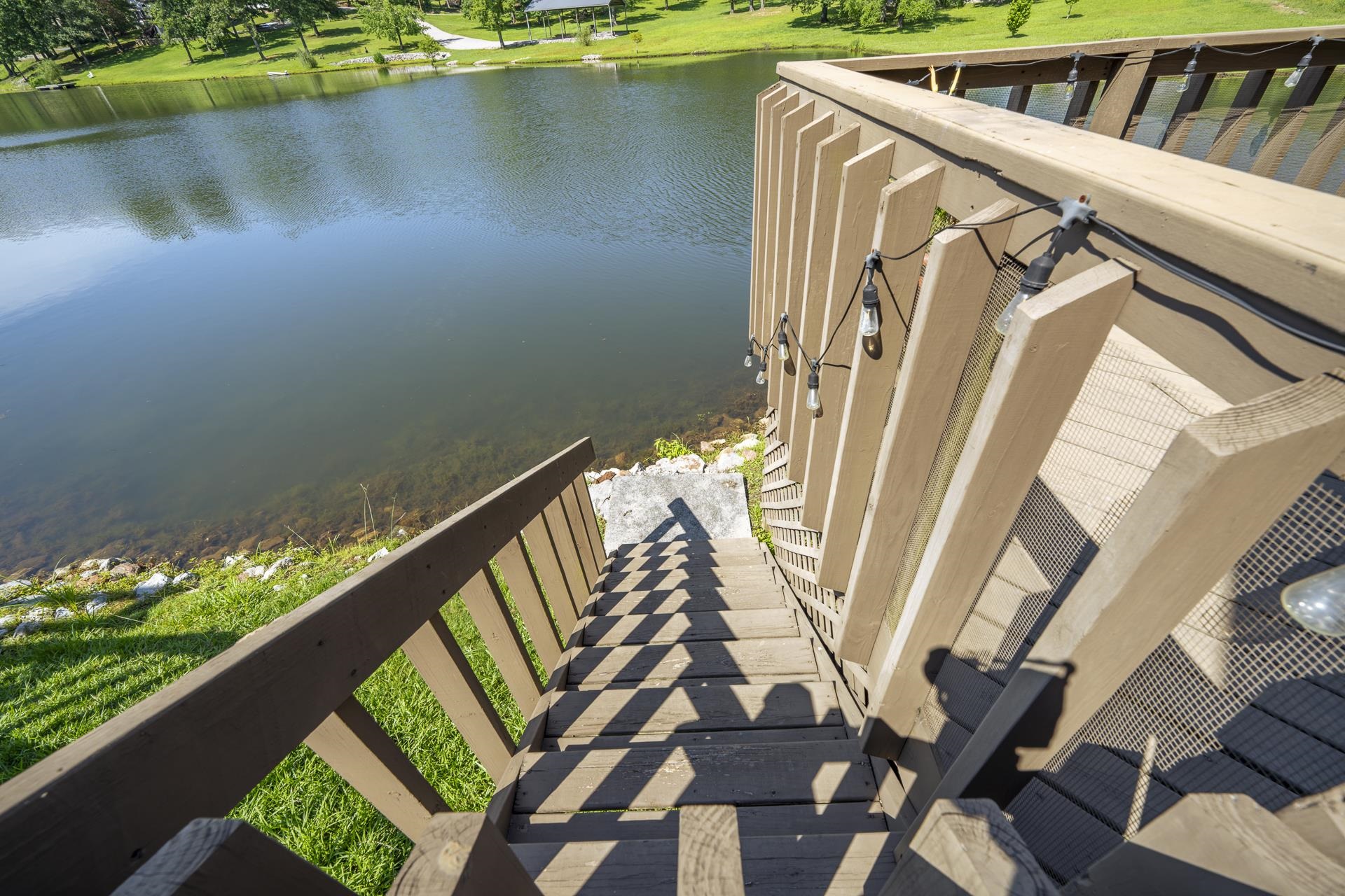 74 Driftwood Road Counce, TN 38326 - Photo 37 of 40 Stairway off the back deck leading to the water and grass area