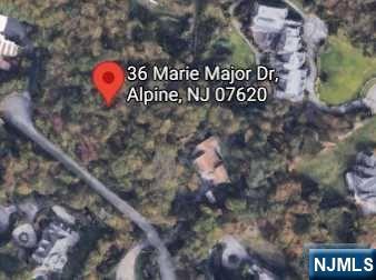 36 Marie Major Drive Alpine, NJ 07620 - Photo 2 of 2 a sign that is on the wall