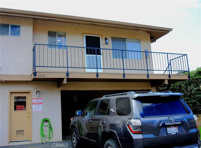 a view of a car park in front of house