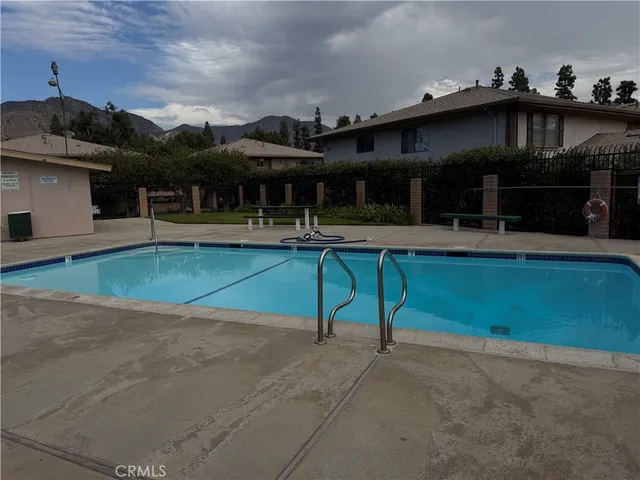 a view of house with outdoor space and a yard
