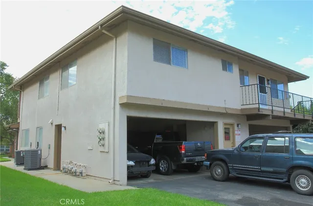 a view of a car park in front of house