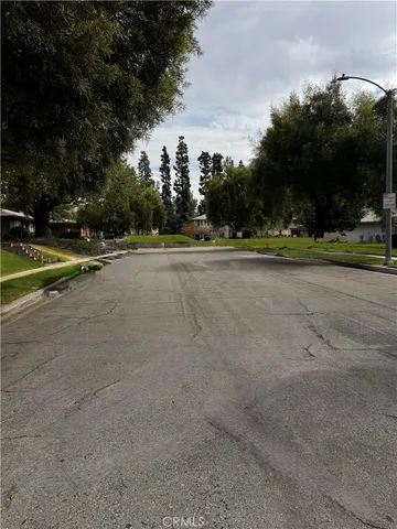 a view of a playground with basketball court
