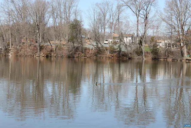 a view of a brick building with a sign broad