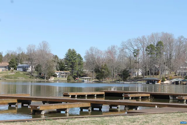 a view of a field with large trees