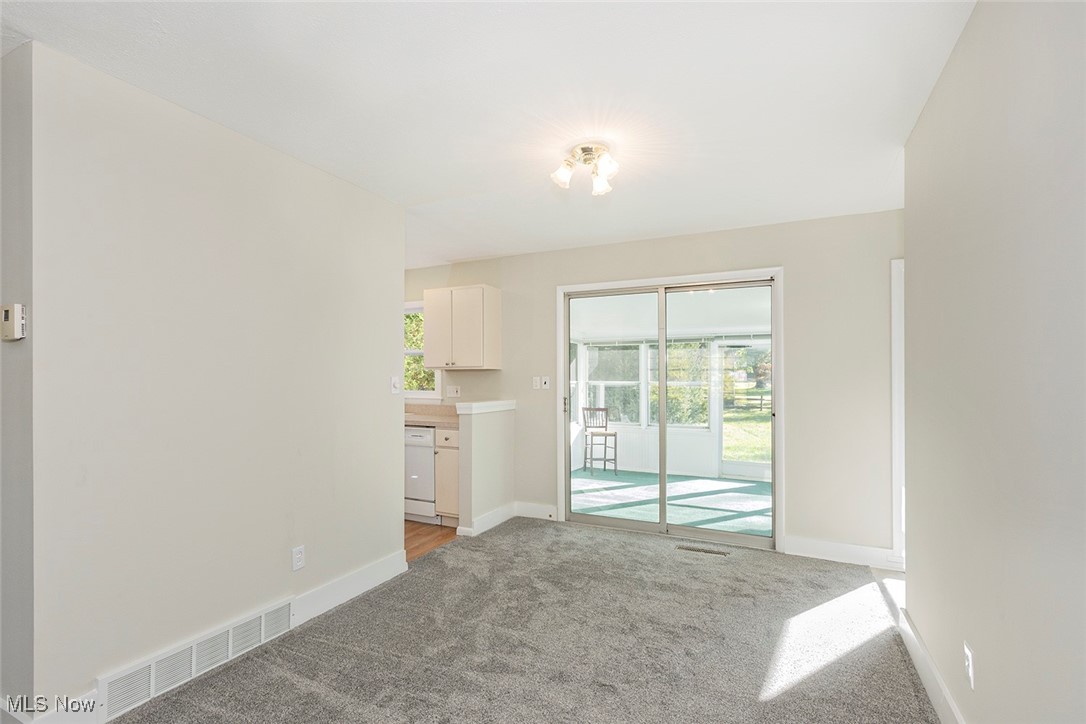 1691 Harwich Road Lyndhurst, OH 44124 - Photo 12 of 45 Spare room with baseboards and light colored carpet