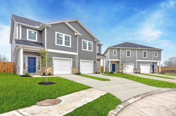 a kitchen with sink stove and refrigerator