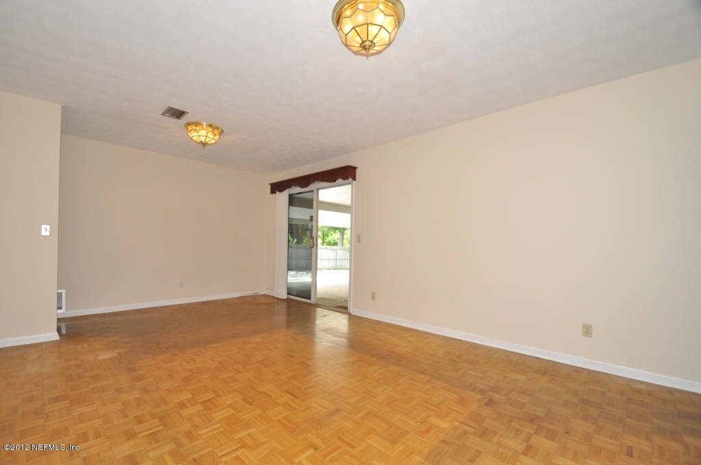 10568 Tulsa Road Jacksonville, FL 32218 - Photo 12 of 31 a view of an empty room and window