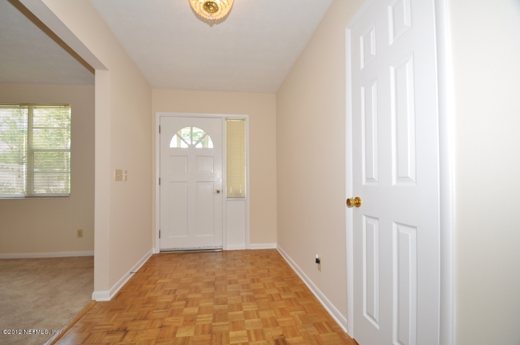 10568 Tulsa Road Jacksonville, FL 32218 - Photo 14 of 31 a view of a hallway to rooms