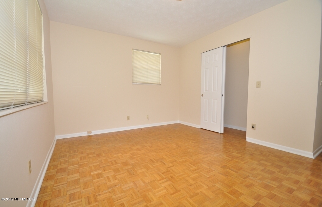 10568 Tulsa Road Jacksonville, FL 32218 - Photo 23 of 31 an empty room with a natural light