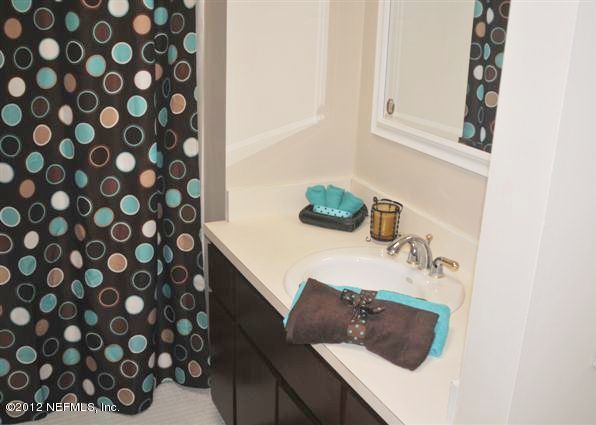 10568 Tulsa Road Jacksonville, FL 32218 - Photo 25 of 31 a bathroom with a sink and vanity