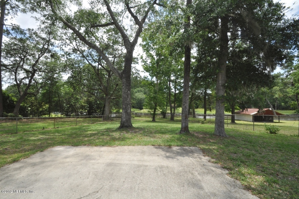 10568 Tulsa Road Jacksonville, FL 32218 - Photo 29 of 31 a view of a park with large trees