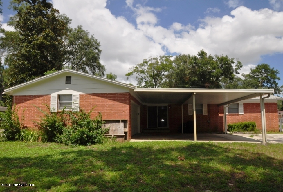 10568 Tulsa Road Jacksonville, FL 32218 - Photo 6 of 31 a front view of house with yard and green space