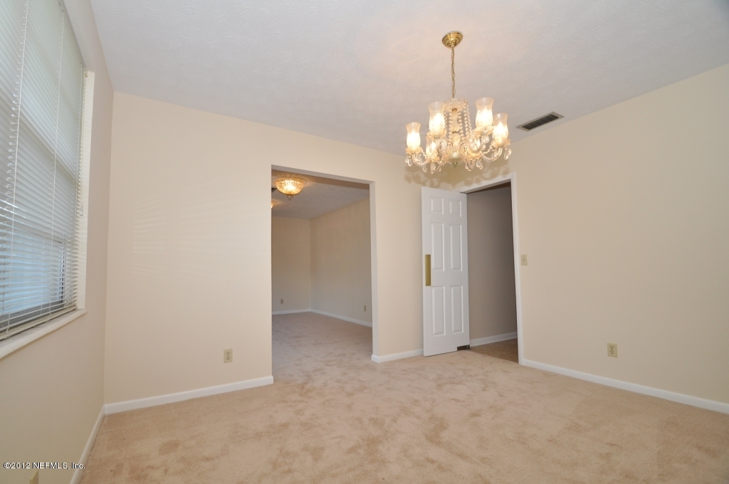 10568 Tulsa Road Jacksonville, FL 32218 - Photo 9 of 31 a view of a chandelier in big room and chandelier