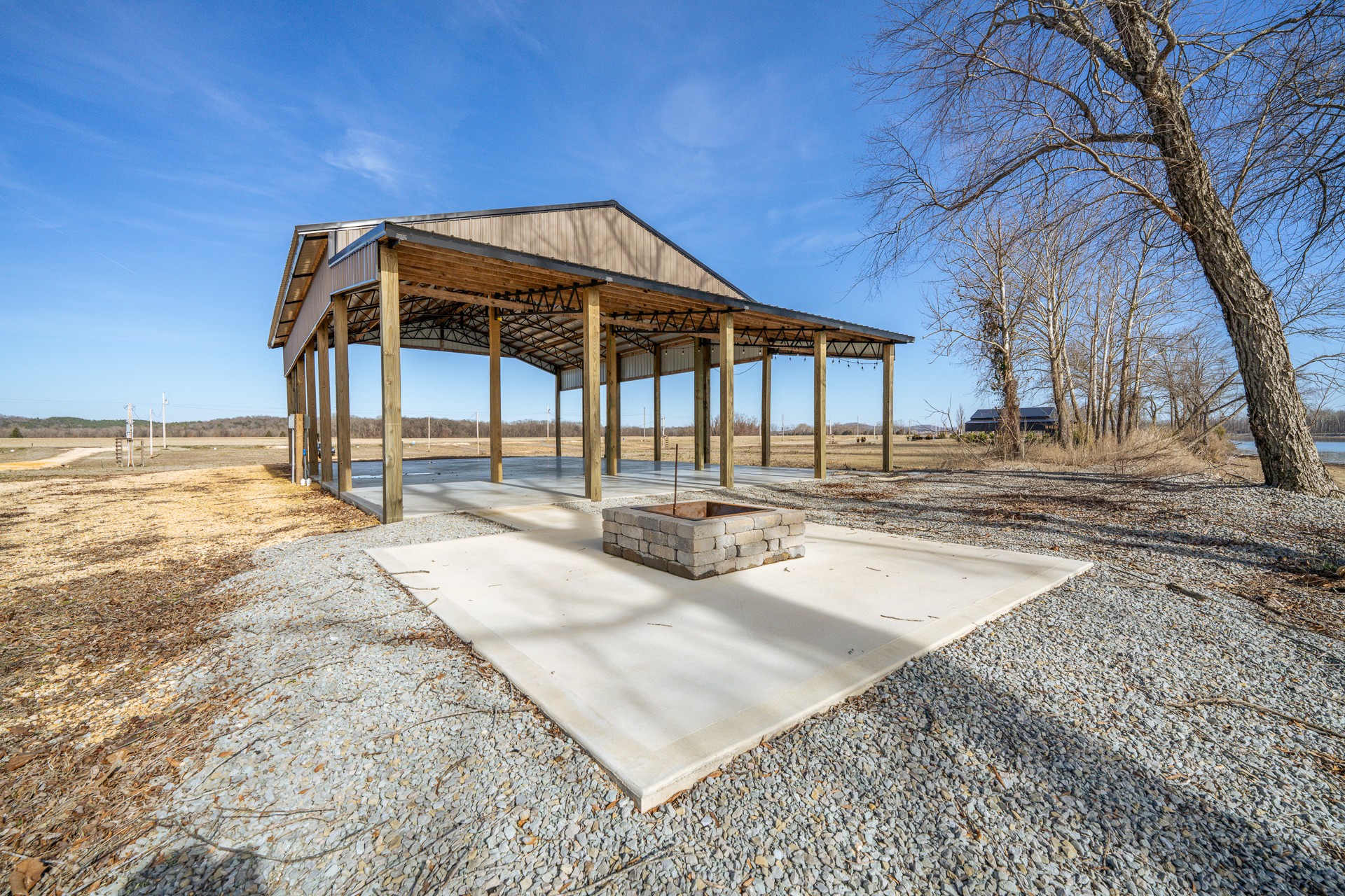 209 Hardin Bottom River Road Clifton, TN 38425 - Photo 17 of 51 a view of a house with backyard and trees