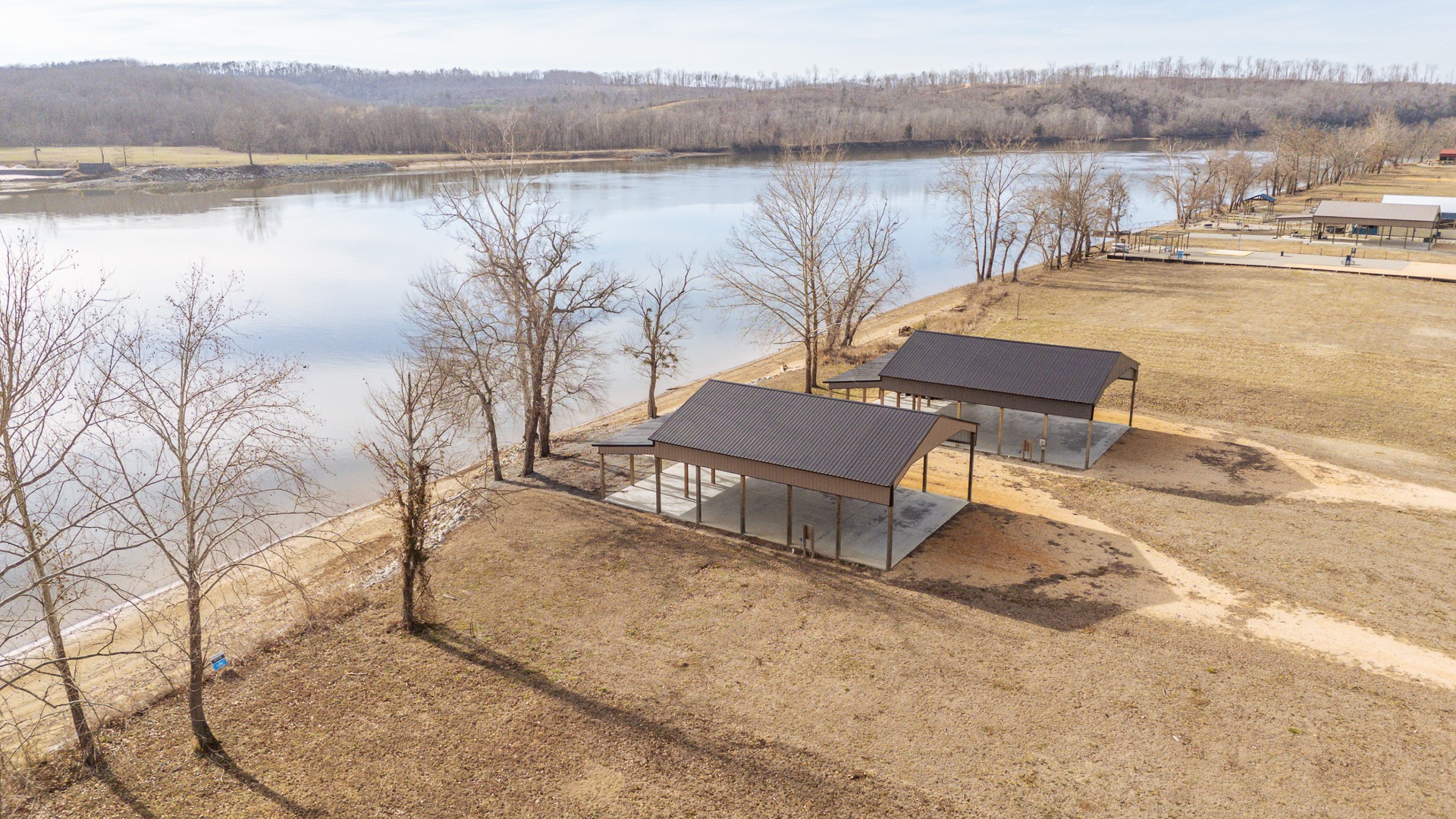 209 Hardin Bottom River Road Clifton, TN 38425 - Photo 5 of 51 a view of a lake with a mountain in the background