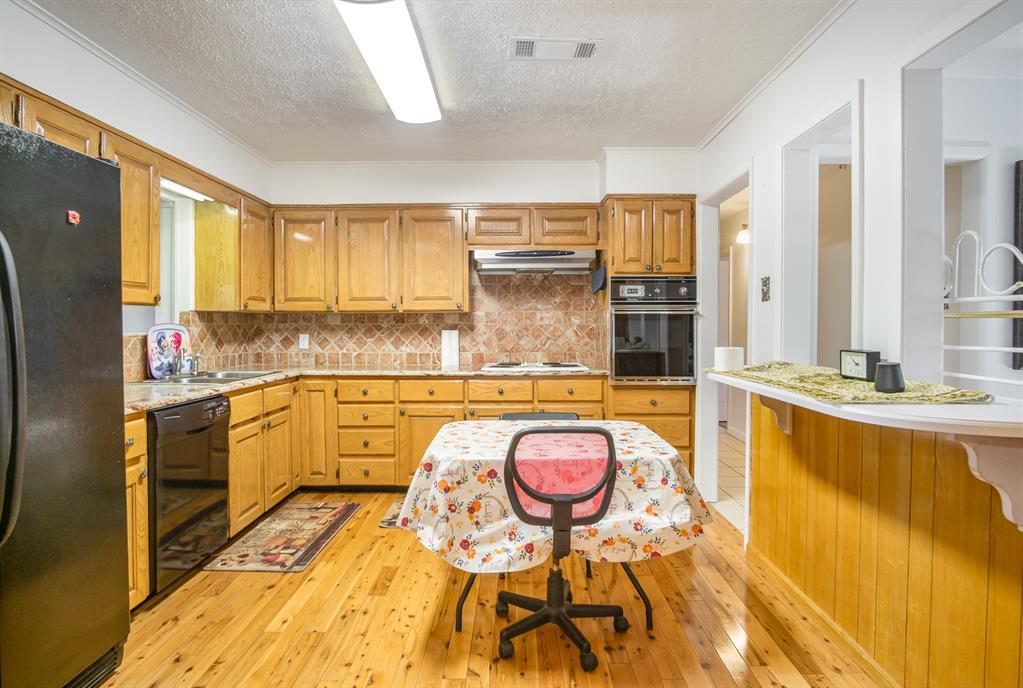 a large kitchen with a large window
