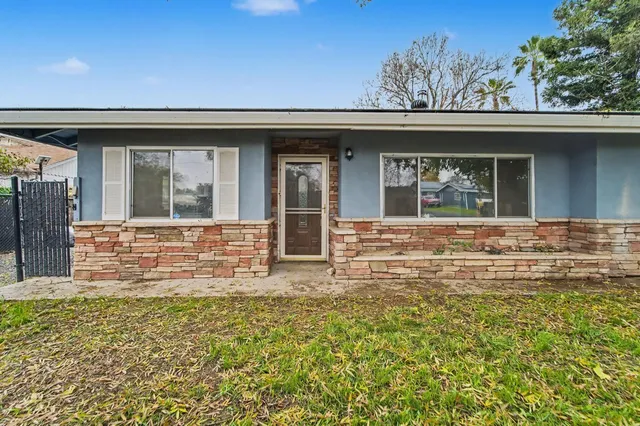front view of a house with a yard