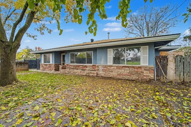 a front view of a house with garden