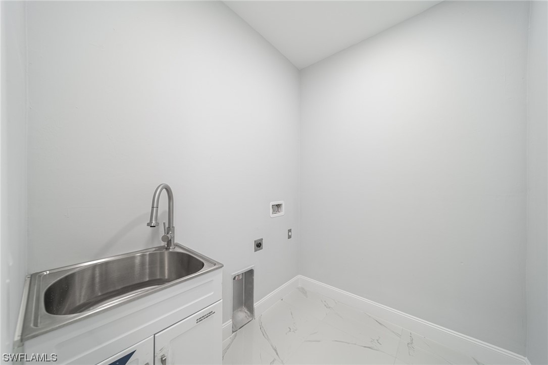 344 Rancho Avenue Lehigh Acres, FL 33974 - Photo 12 of 27 a close view of a sink and tap